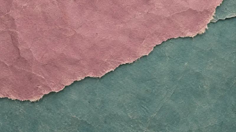 Torn paper texture in muted magenta smoky teal